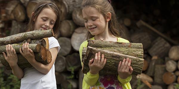 Children carrying logs