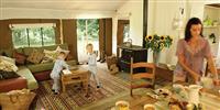 Family inside glamping camp site enjoying lunch