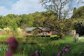 View across the ornamental lake to our Exton glamping site