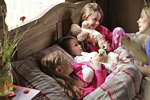 Mum telling a story to kids before bed - thumbnail