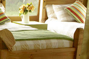 Sleep tight in a solid pine bed on a comfortable mattress