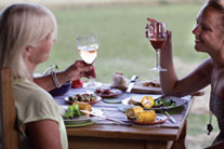 Mum and daughter catching up over a glass of wine - thumbnail