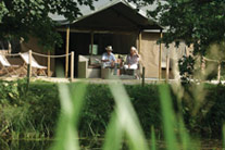 A couple drinking wine at the terrace - photo from a distance