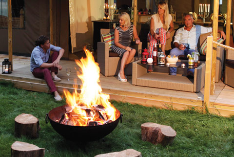 Group gathering around the fire pit in the evening